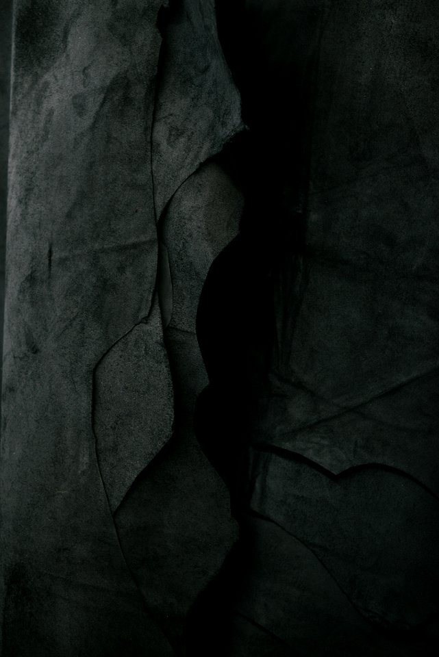 Darkened image of a rock wall. photo