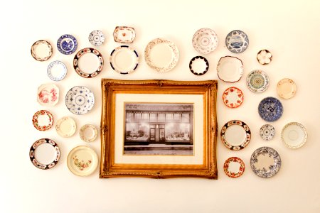 photo frame near assorted-color ceramic dishes