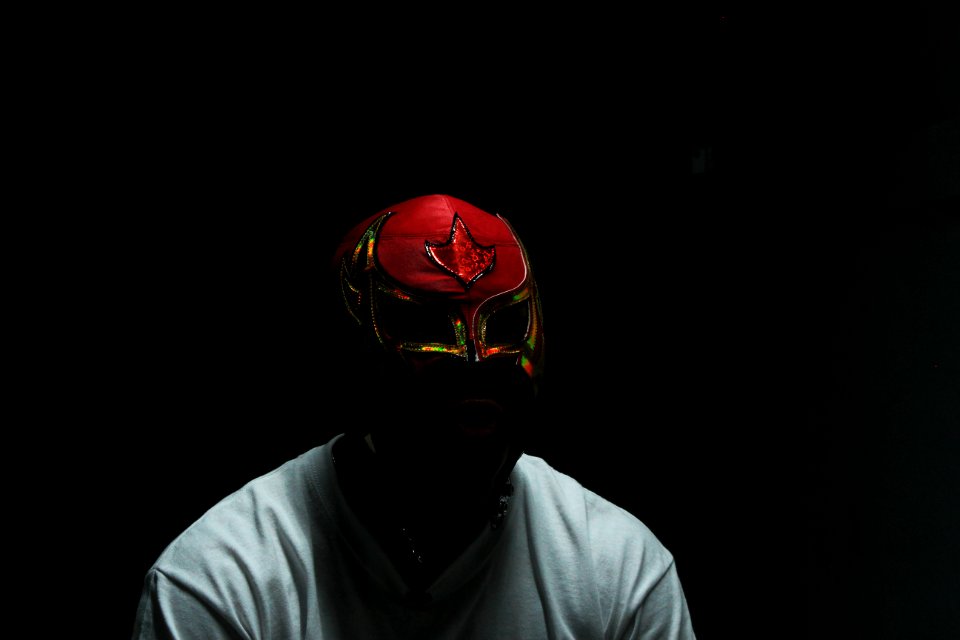 man wearing red mask and white shirt