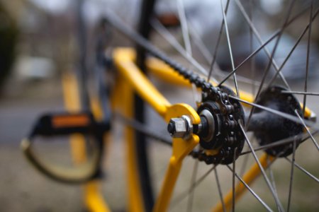 yellow and black bicycle close-up photography photo