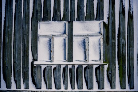 two white wooden framed 3-pane window freezed during daytime photo