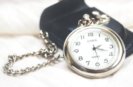 round silver-colored Dawn analog pocket watch photo