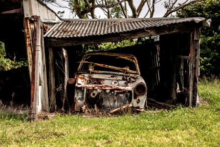 vintage car on garage during daytime photo
