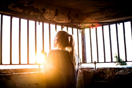woman behind the bars