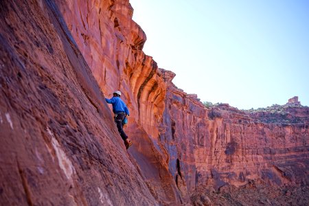 man climbing on mountain rock