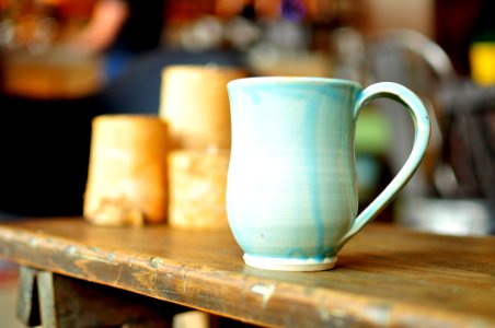 focused photo of a blue ceramic mug