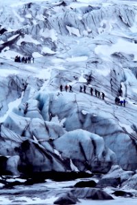 people on snow covered mountain photo