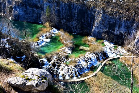 aerial photo of bridge near rock formation photo