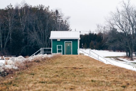 green house near trees at daytime