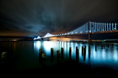 photo of suspension bridge during nighttime photo