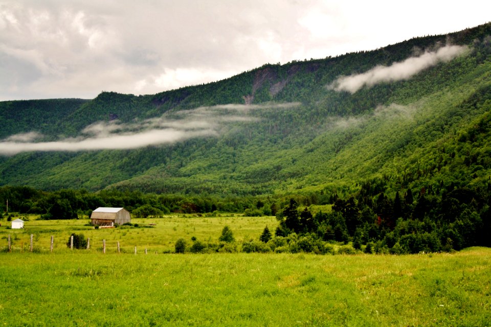 brown house near mountain peak