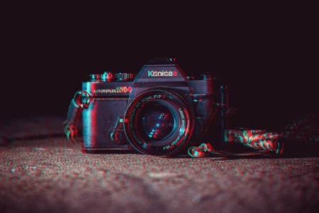 shallow focus photography of black Konica DSLR camera photo