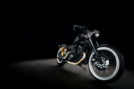 black bone motorcycle on black background photo