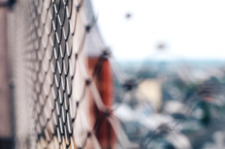selective focus photography of gray chain-link fence photo