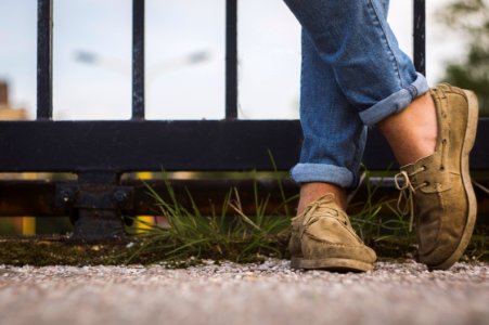 person pair of brown loafers photo