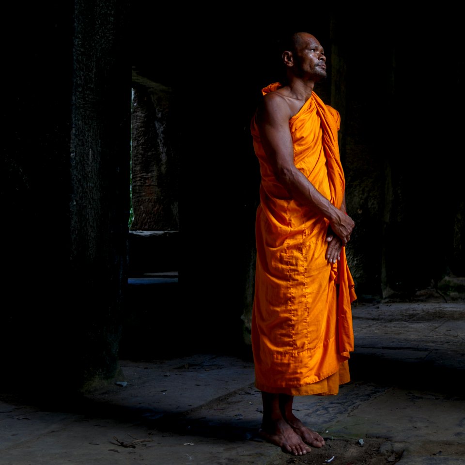 man standing on dimmed area