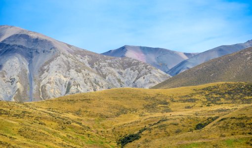 landscape photo of green field and mountainms photo