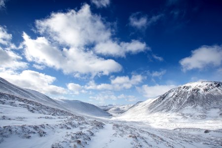 mountain coated by snow during daytime photo