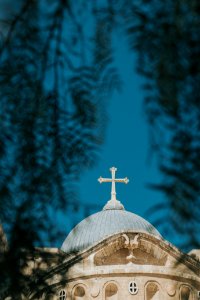 low-angle photography of white and blue church photo