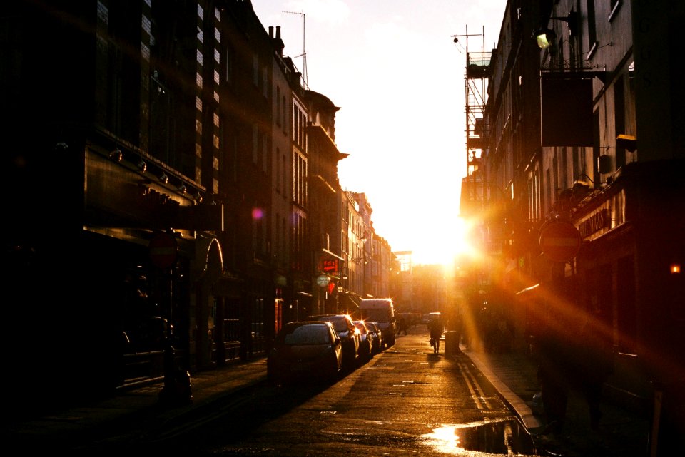 car parking near store during sunset