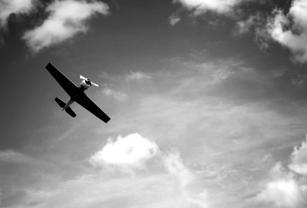 greyscale photography of plane flying