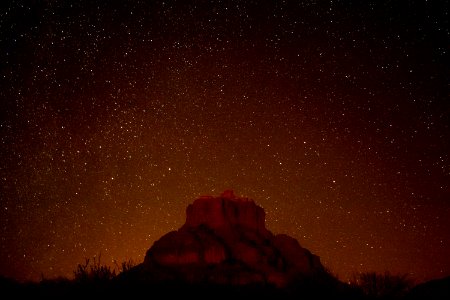 brown mountain under starry sky during nighttime in timelapse photography