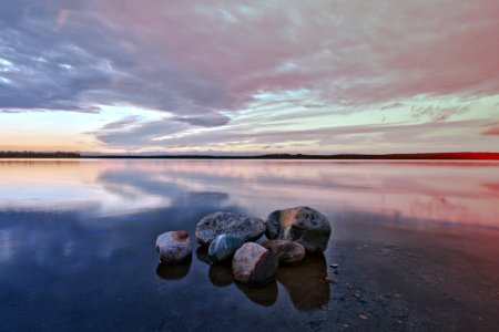 gray and black rocks on seashore during daytime photo