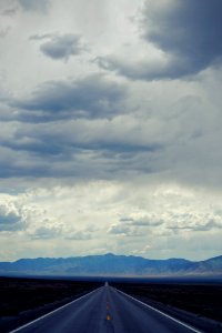 white clouds over green mountains during daytime