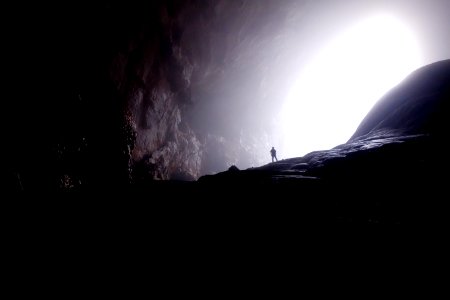 person inside of cave
