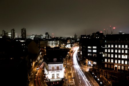 aerial photography of vehicles passing on road at night