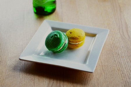two macarons in square white plate photo