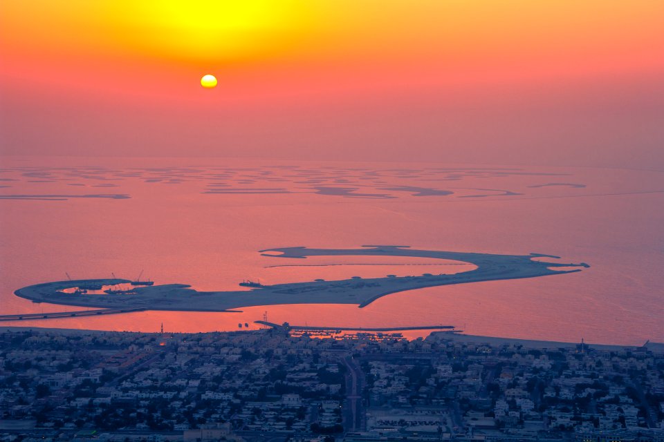 seaside city during sunset