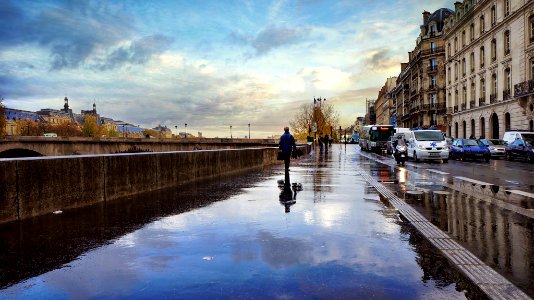 man walking beside the street photo