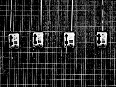 four black-and-grey telephones photo