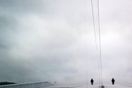 two person standing in the middle of road during daytime
