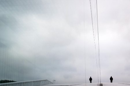 two person standing in the middle of road during daytime photo