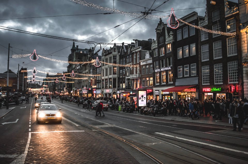 crowd of people walking on the street photo