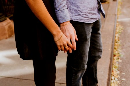 woman touching man's hand photo