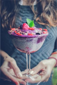 shaved ice with strawberry and blueberry toppings