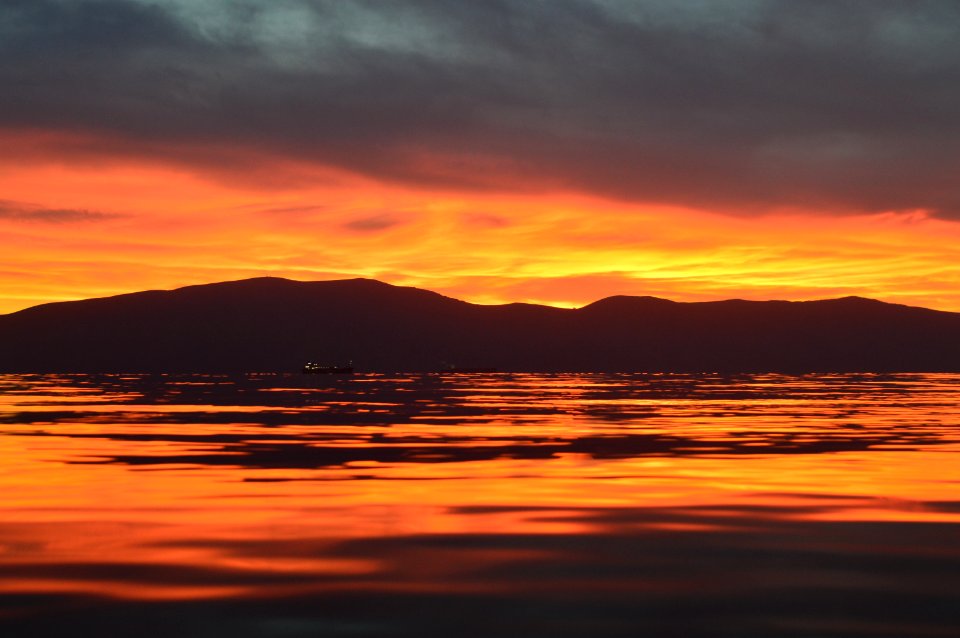 silhouette of mountains during sunset photo