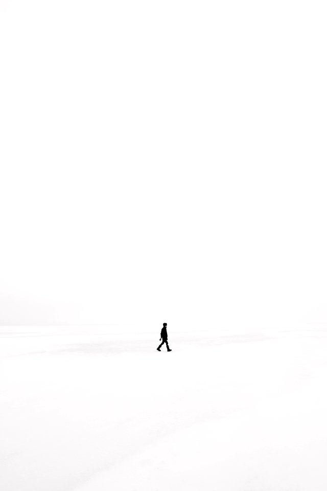 person walking on snowfield