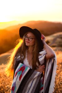 woman surrounded by plants during sunset photo