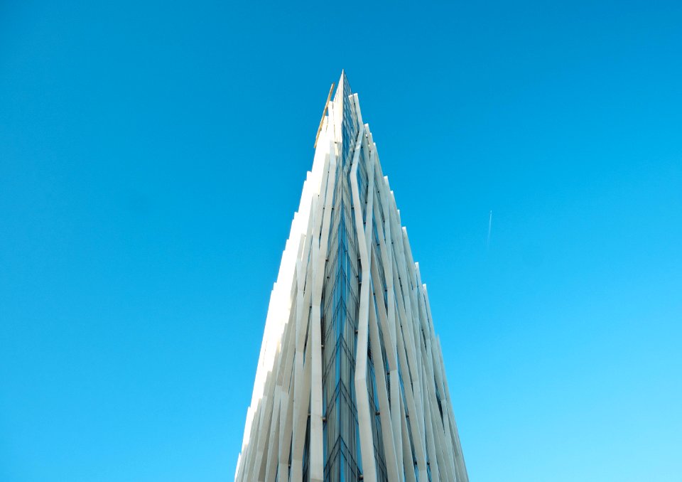 photography of white building under clear blue sky
