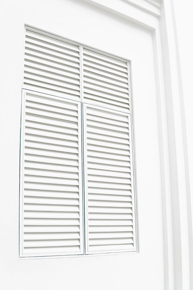 white wooden louvered door