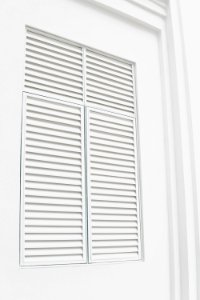 white wooden louvered door