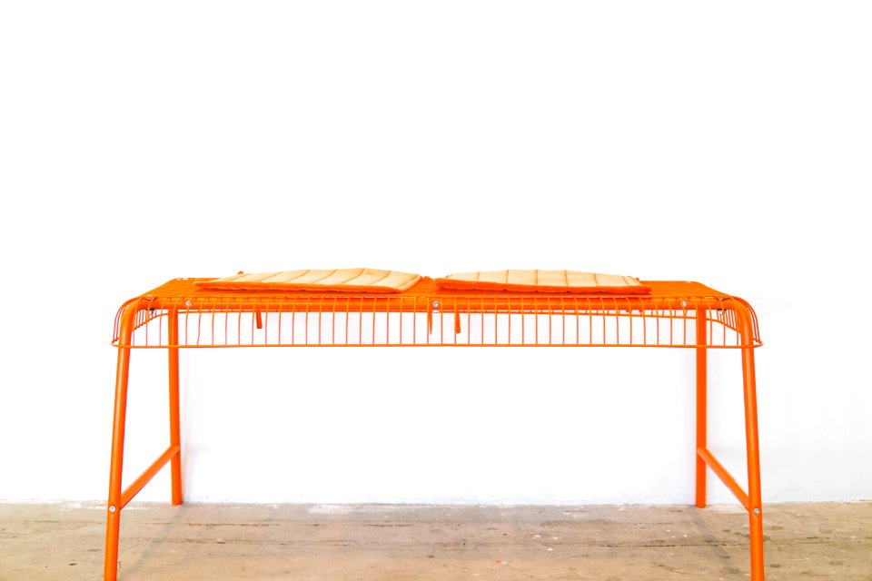 orange steel scaffolding on brown surface