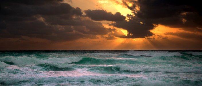 photography of ocean waves during golden hour photo