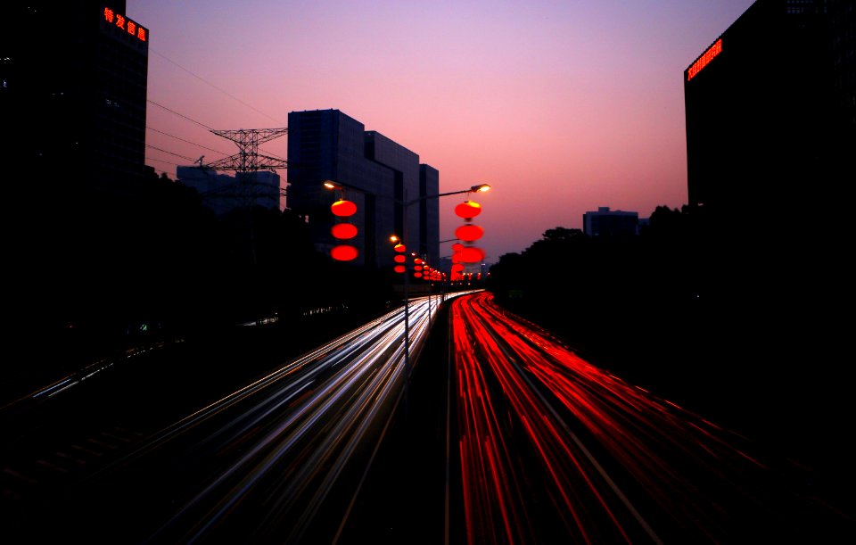 timelapes photography of car lights on road during night time