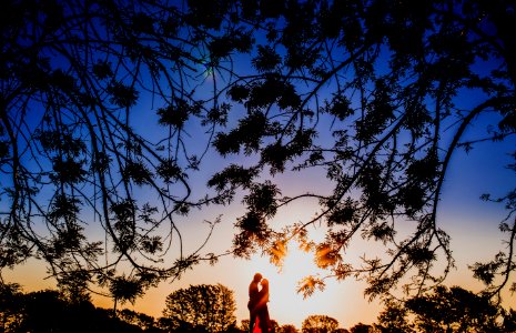 silhouette photo of man and woman hugging each other