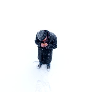 man standing on snow photo